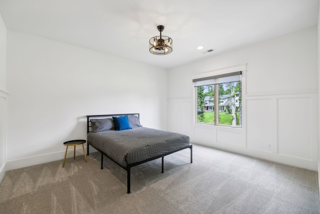 bedroom with light colored carpet