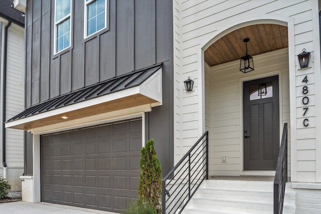 view of exterior entry featuring a garage