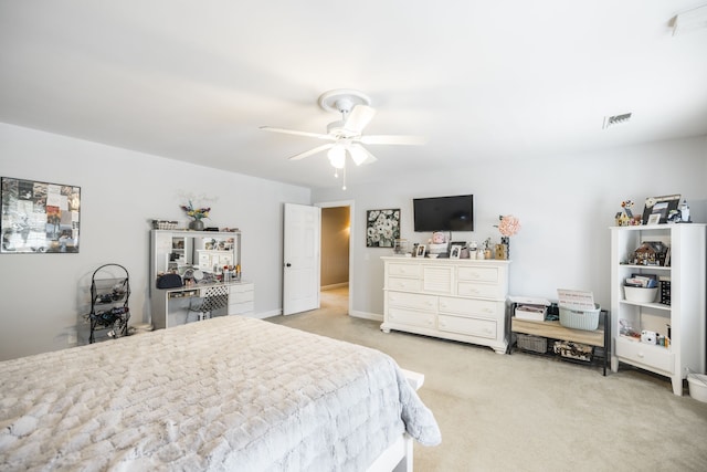 bedroom featuring light carpet and ceiling fan