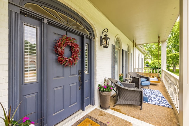 property entrance featuring covered porch