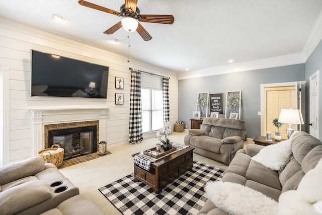 living room featuring a brick fireplace, carpet floors, a textured ceiling, ceiling fan, and crown molding