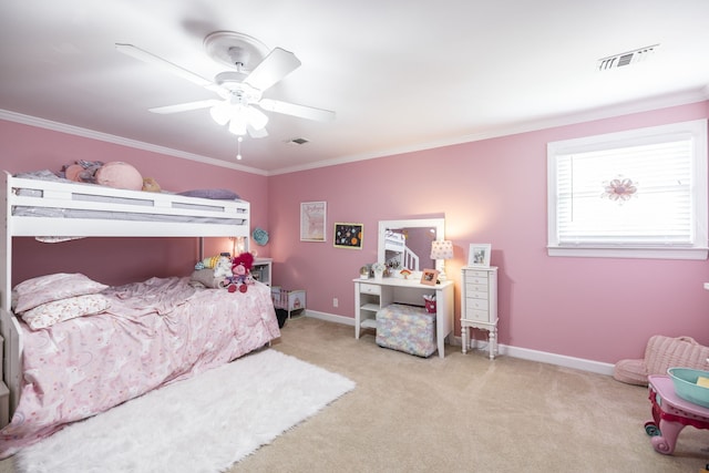 carpeted bedroom with ceiling fan and crown molding