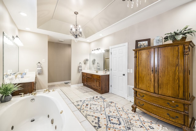 bathroom with an inviting chandelier, vanity, a raised ceiling, a bath, and tile patterned floors