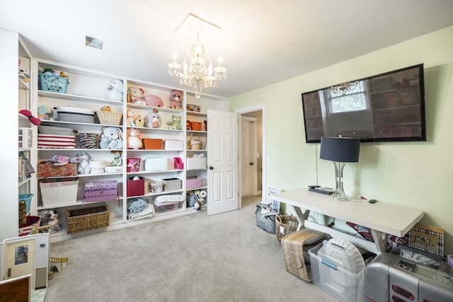 home office with a chandelier and light carpet