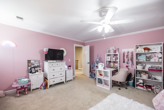 carpeted office space with ceiling fan and crown molding