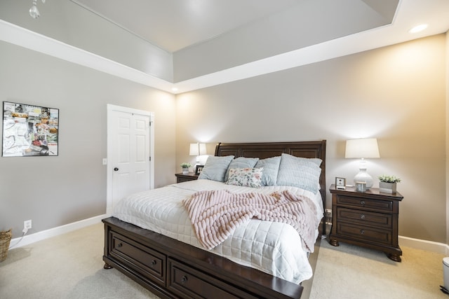 bedroom with light colored carpet