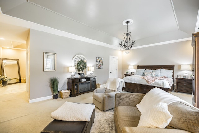 carpeted bedroom featuring a raised ceiling and a notable chandelier