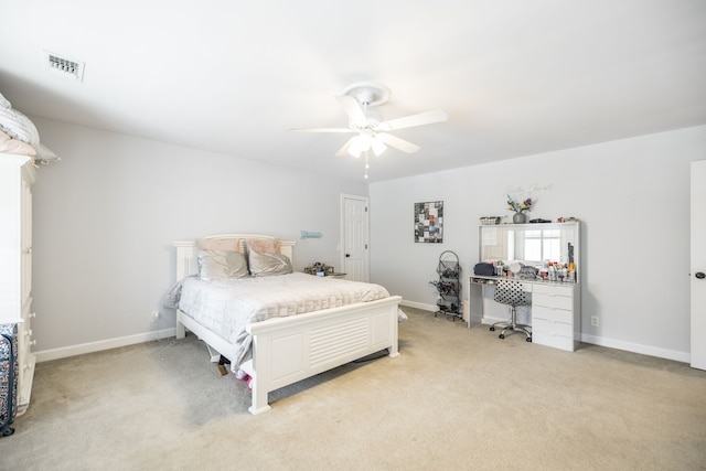 bedroom featuring light carpet and ceiling fan