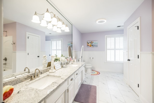 full bathroom featuring vanity, toilet, shower / bathtub combination, and a notable chandelier