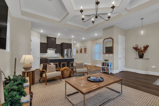 living room with beamed ceiling, dark hardwood / wood-style flooring, coffered ceiling, and a notable chandelier