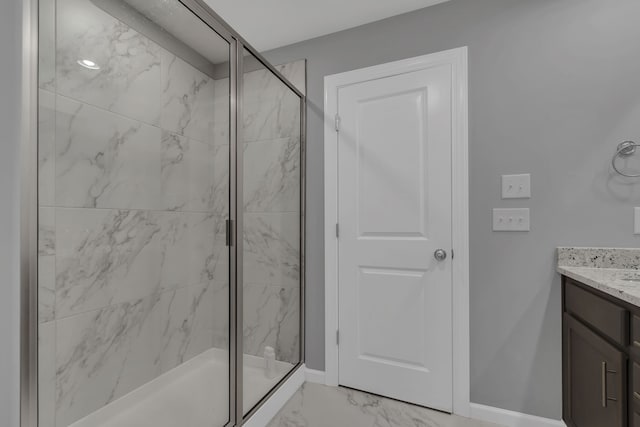 bathroom with vanity and a shower with shower door