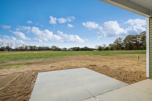 view of yard with a patio and a rural view