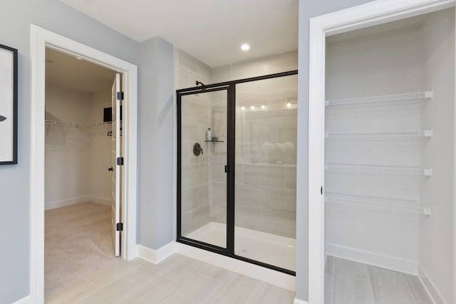 bathroom with a shower with shower door