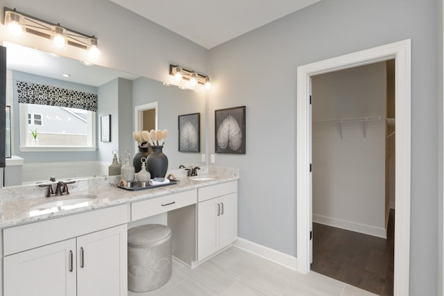 bathroom with vanity and hardwood / wood-style flooring