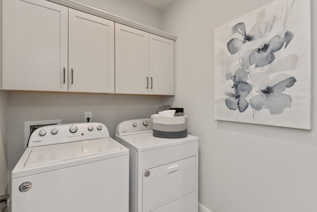 laundry area featuring cabinets and washing machine and clothes dryer