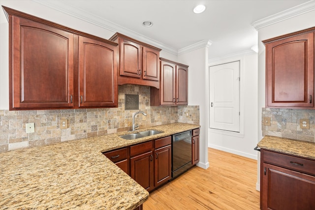 kitchen with light wood-type flooring, black dishwasher, light stone countertops, decorative backsplash, and sink