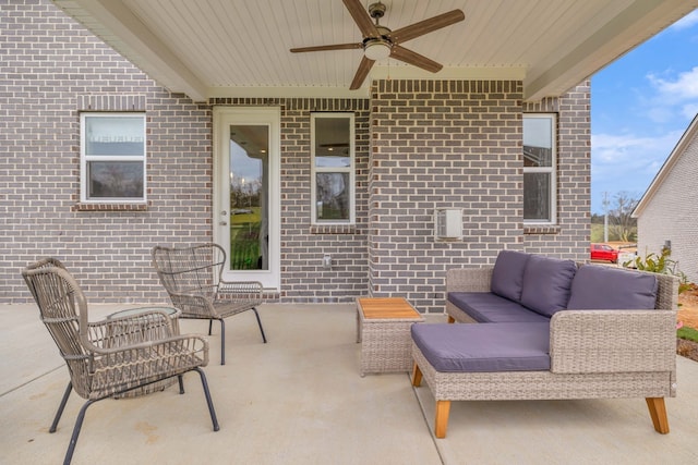 view of patio with ceiling fan and an outdoor living space