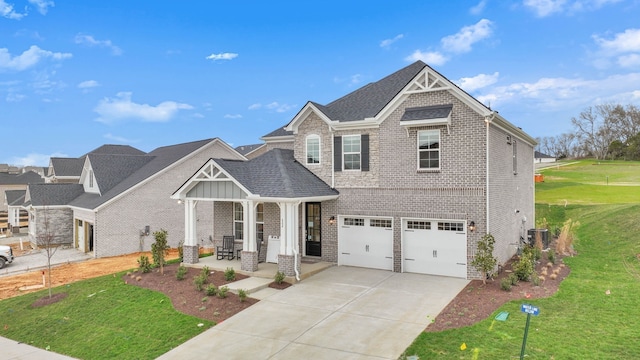 craftsman house with a garage and a front yard