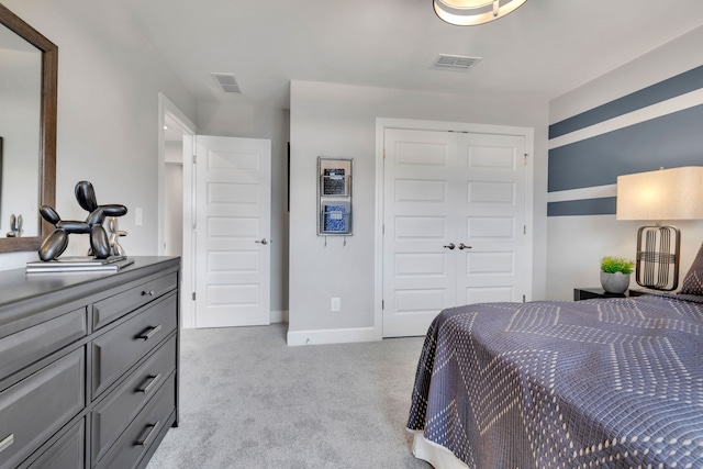 carpeted bedroom featuring a closet