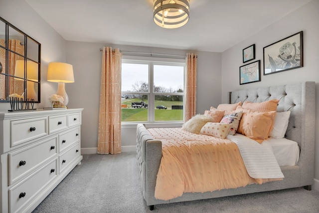 bedroom with light colored carpet