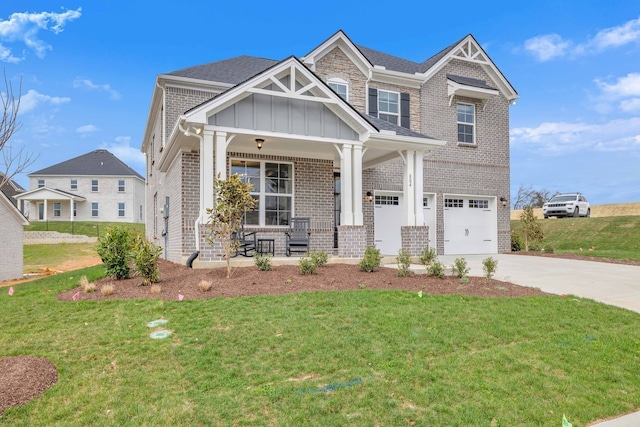 craftsman house featuring a front lawn, a porch, and a garage