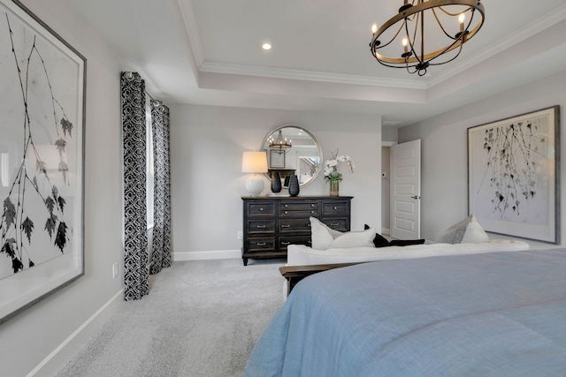 bedroom with carpet flooring, a raised ceiling, a chandelier, and ornamental molding