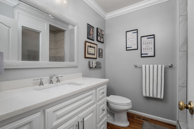 bathroom featuring walk in shower, ornamental molding, wood-type flooring, vanity, and toilet