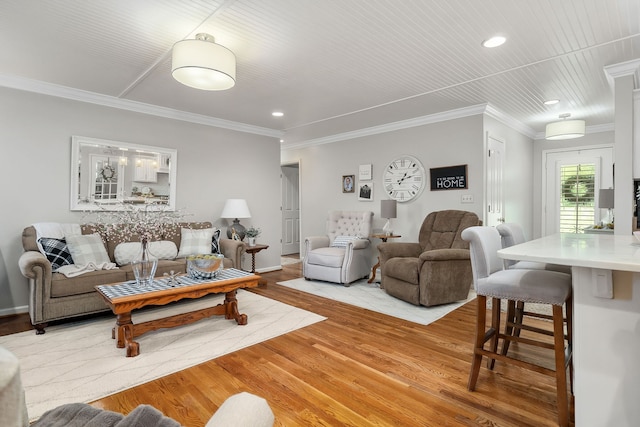 living room with light hardwood / wood-style floors and crown molding