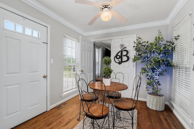 dining space featuring ceiling fan, dark hardwood / wood-style flooring, and ornamental molding