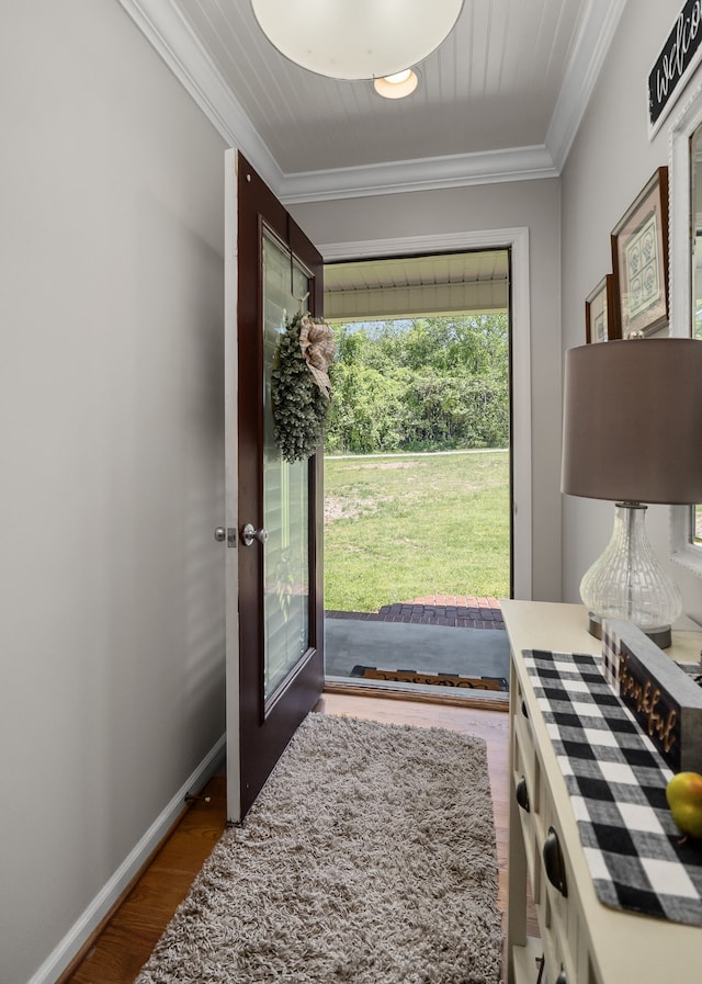 doorway with dark wood-type flooring, french doors, and ornamental molding