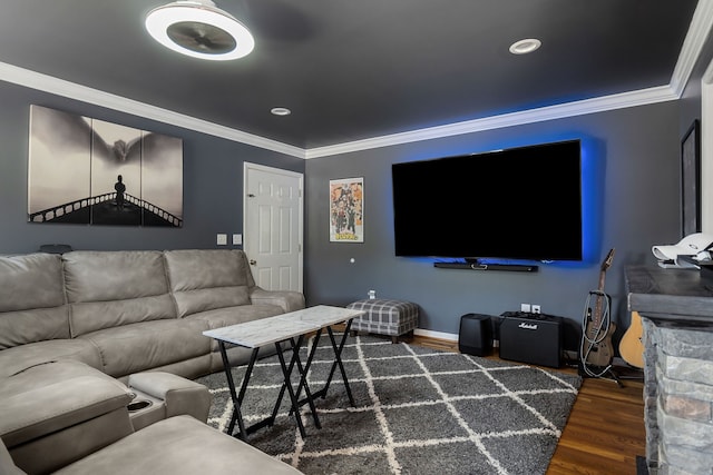 cinema room featuring ornamental molding and dark hardwood / wood-style flooring