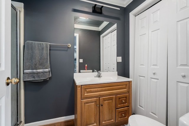 bathroom featuring vanity, crown molding, and a shower with door