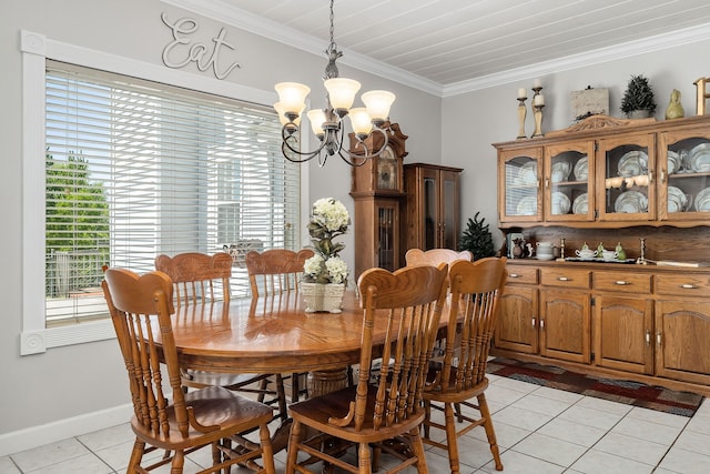 dining space featuring ornamental molding, a notable chandelier, and light tile patterned flooring