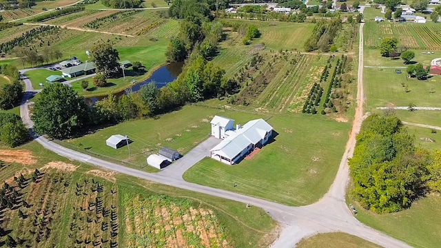 aerial view with a water view and a rural view