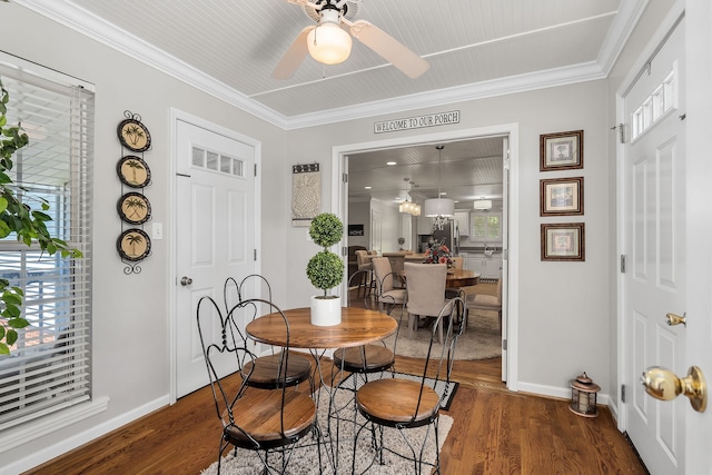 dining room featuring dark wood-type flooring, ceiling fan, and crown molding