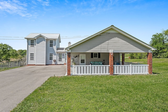 view of front of home with a front lawn and a porch