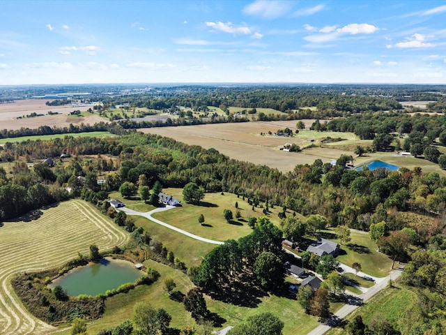 birds eye view of property with a rural view and a water view