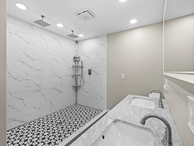 bathroom featuring vanity and a tile shower