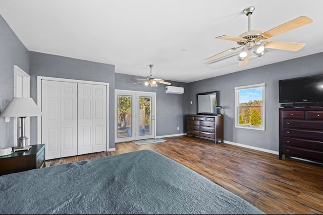 unfurnished bedroom with access to outside, ceiling fan, dark hardwood / wood-style flooring, and a wall mounted air conditioner