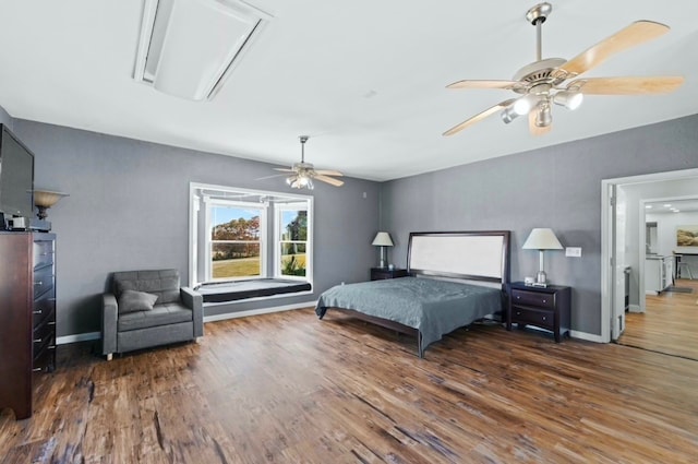 bedroom featuring ceiling fan and dark hardwood / wood-style floors