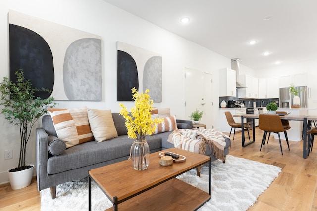 living room with light hardwood / wood-style flooring