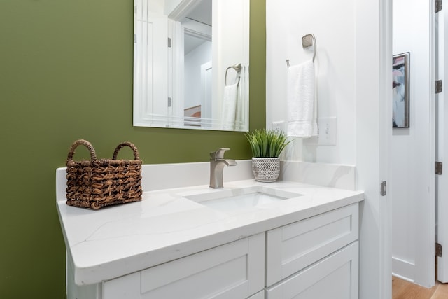 bathroom featuring vanity and hardwood / wood-style floors