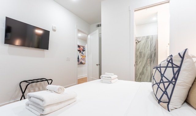 bedroom with a closet and light hardwood / wood-style flooring