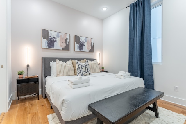 bedroom featuring wood-type flooring