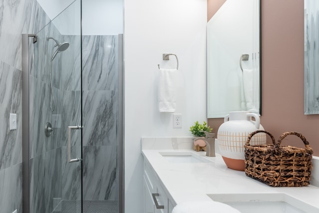 bathroom featuring vanity and a shower with door