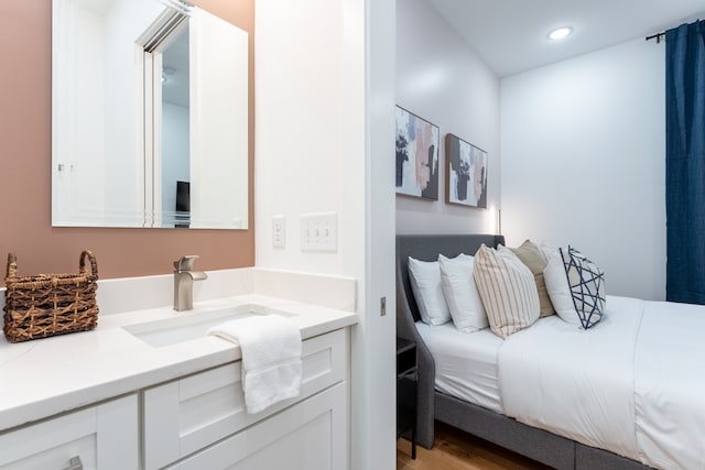 bathroom featuring hardwood / wood-style flooring and vanity