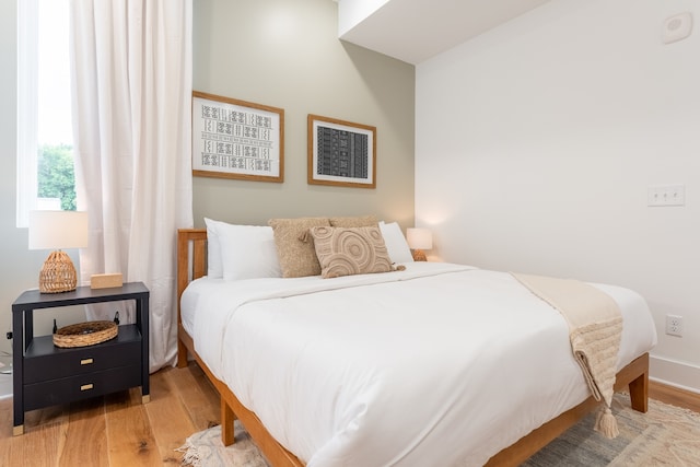 bedroom featuring hardwood / wood-style flooring