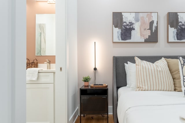 bedroom with hardwood / wood-style flooring