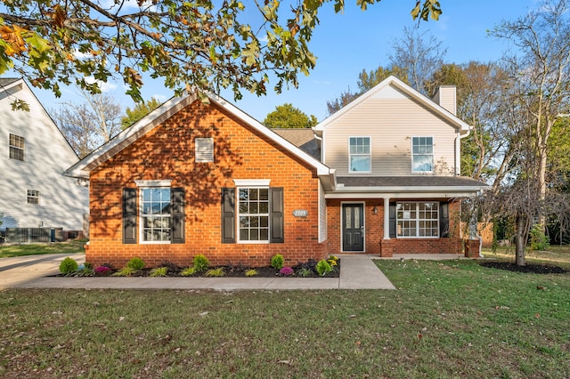 front facade with a front lawn