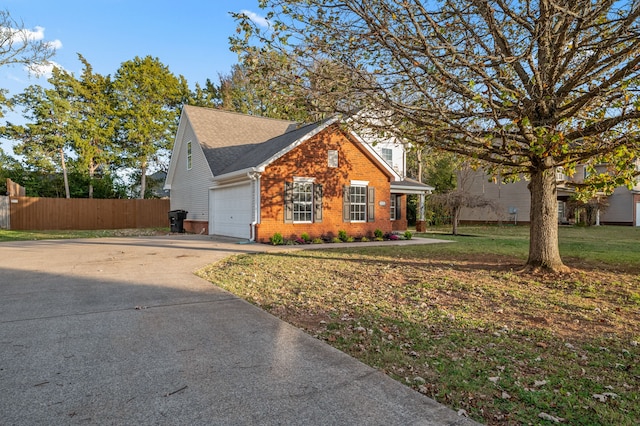 view of front of home featuring a front yard and a garage